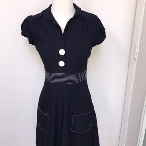 Navy blue dress with white buttons